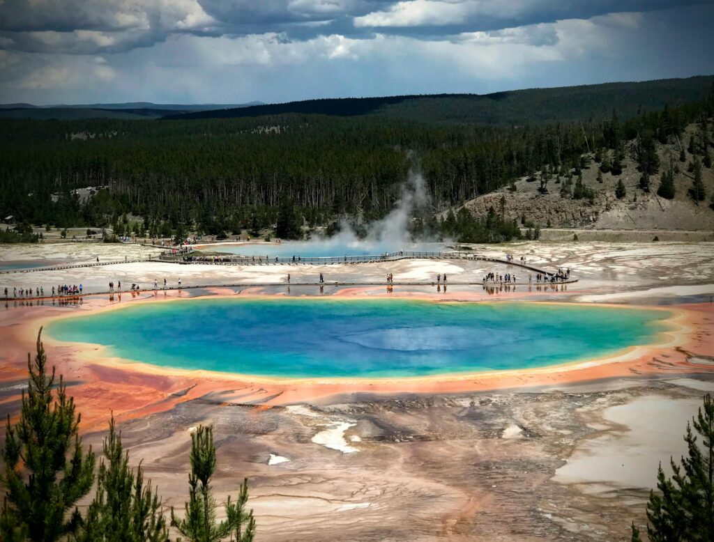 Aerial view of the vibrant Grand Prismatic Spring in Yellowstone National Park showcasing colorful geothermal features.